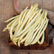 Close-up of Sunshine pole bean pods showing slender butter-yellow pods in a small wooden crate on burlap