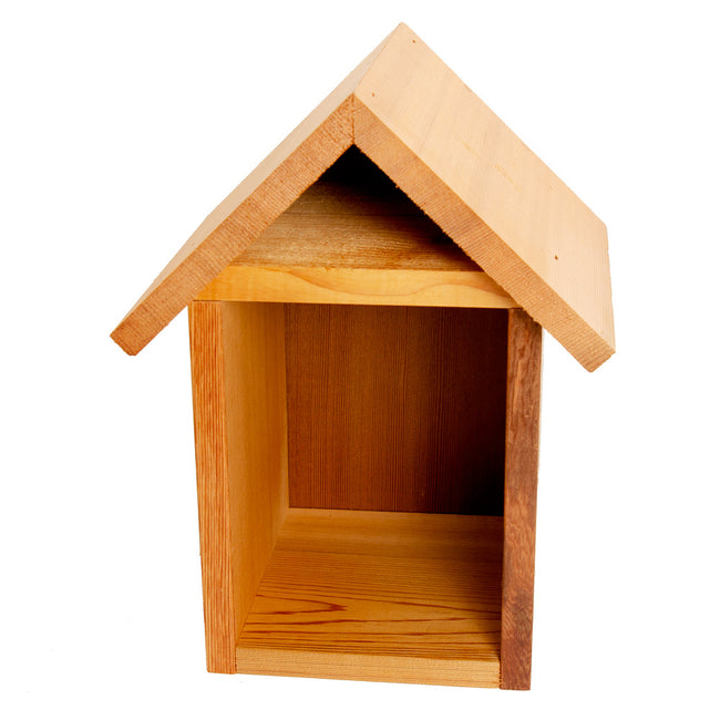Front view of mason bee tower house showing cedar construction, pitched roof, and open nesting cavity on white background