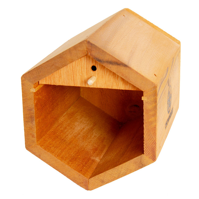 Front view of Villa Bee House showcasing hexagonal opening and cedar construction on white background