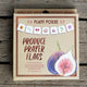 Front view of produce flag banner showing seven 4-inch watercolor produce paintings on waterproof, UV-protected canvas strung on hemp cord