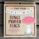 Box of Fungi Prayer Flags with mushroom design on a wooden surface