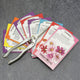Front view of Easy-Care Flower Cutting Garden Kit showing nine colorful seed packets fanned with snips.