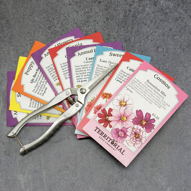 Front view of Easy-Care Flower Cutting Garden Kit showing nine colorful seed packets fanned with snips.