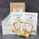Front view of New Gardener Success Starter kit showing seed packets, plant labels, instruction sheets, and box on white background