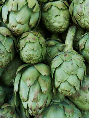 Close-up of a pile of green artichokes