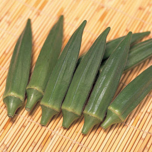 Close-up of Jambalaya okra pods showing five-ridged, meaty green pods on a bamboo mat