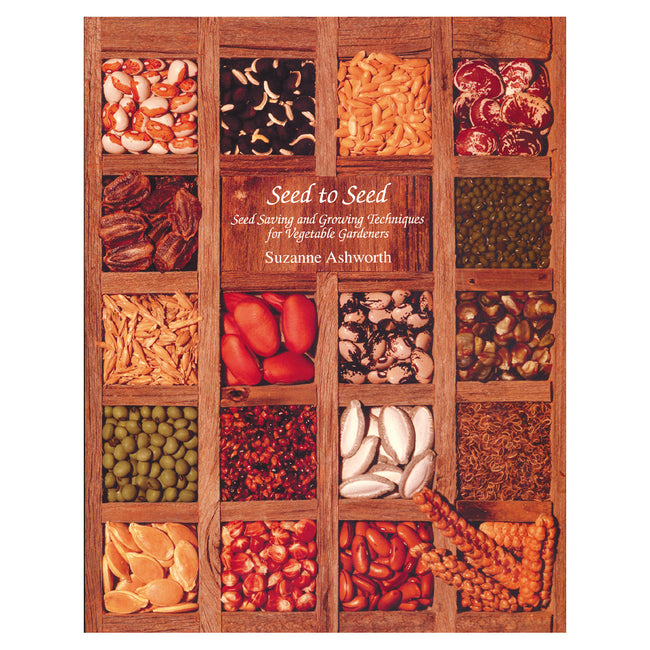 Front cover of Seed to Seed paperback showing a wooden grid of assorted vegetable seeds