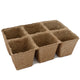 Three-quarter view of 6-cell Cow Pots biodegradable seed starter made from composted cow manure on white background
