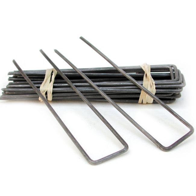 Angled view of Fabric Staples, pack of 30, showing two 6 x 1 inch 11-gauge U-shaped metal staples on white background