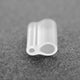 Close-up of silicone grafting clip showing U-shaped profile and 1.7 mm diameter on dark textured background