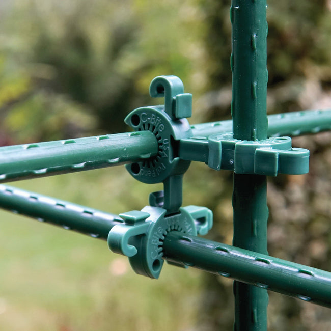 Close-up of C-Bite stake clip showing three-direction connector and netting hook on white background